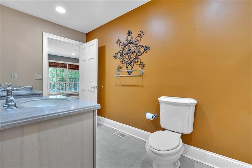 2 Stonebrook Drive Rome, GA 30165 - Photo 26 of 44 a bathroom with a toilet sink and mirror