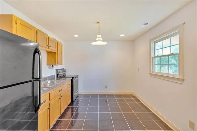 a spacious bathroom with a double vanity sink and a mirror