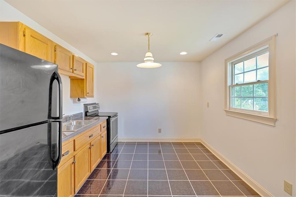 2 Stonebrook Drive Rome, GA 30165 - Photo 30 of 44 a bathroom with a sink a mirror and a shower