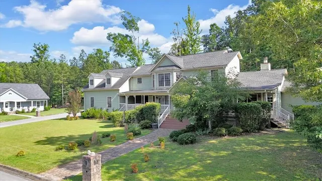 a front view of a house with garden