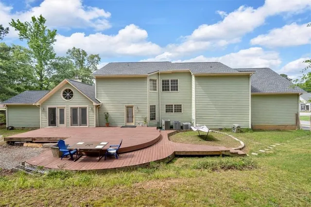 a view of a swimming pool with a yard