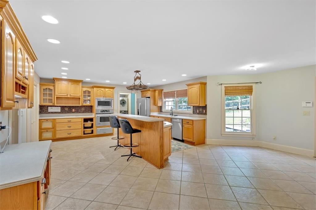 2 Stonebrook Drive Rome, GA 30165 - Photo 4 of 44 a living room with stainless steel appliances kitchen island granite countertop furniture and a kitchen view