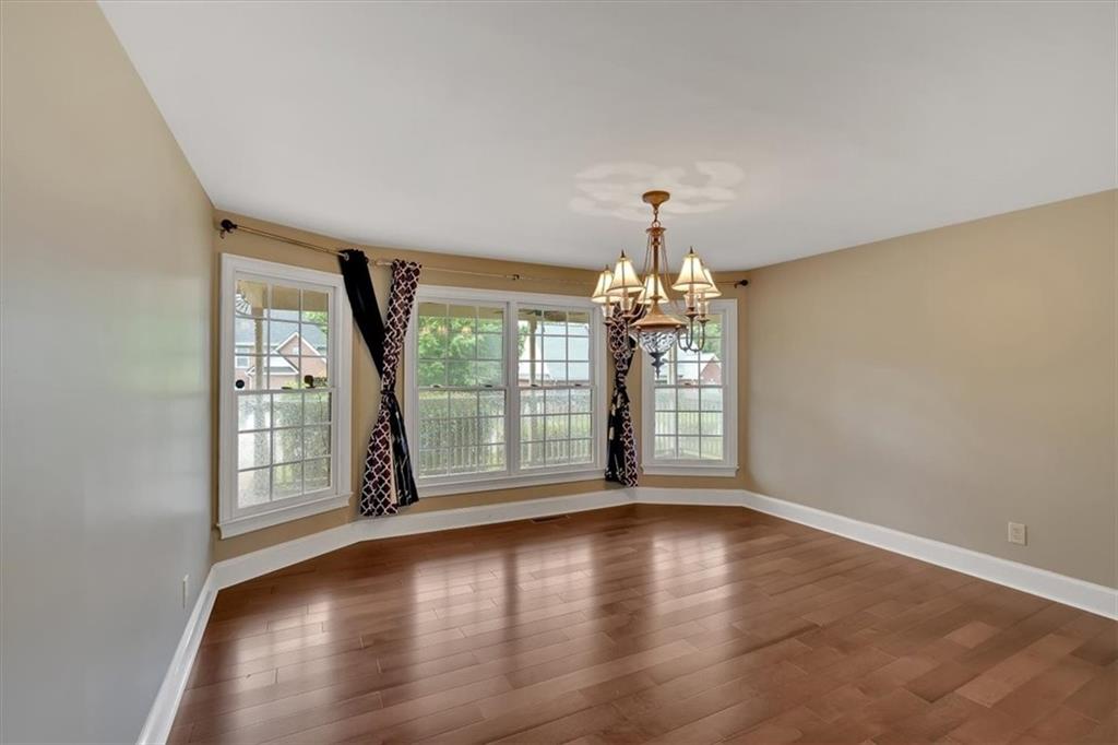 2 Stonebrook Drive Rome, GA 30165 - Photo 5 of 44 wooden floor in an empty room with a window