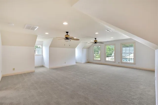 a kitchen with stainless steel appliances granite countertop a stove a refrigerator and a sink