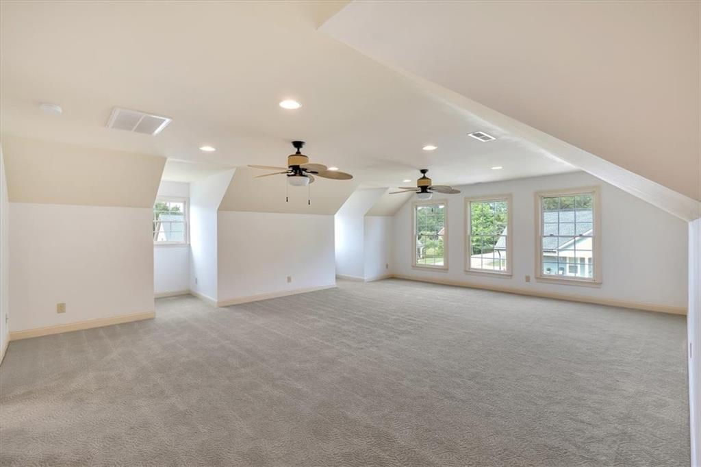 2 Stonebrook Drive Rome, GA 30165 - Photo 6 of 44 an empty room with windows and chandelier fan
