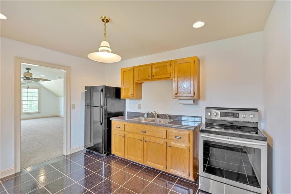2 Stonebrook Drive Rome, GA 30165 - Photo 7 of 44 a kitchen with stainless steel appliances granite countertop a stove a refrigerator and a sink