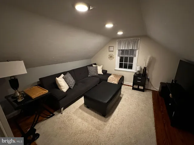 a living room with furniture fireplace and a flat screen tv