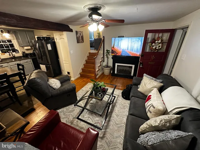 a front view of a house with wooden fence
