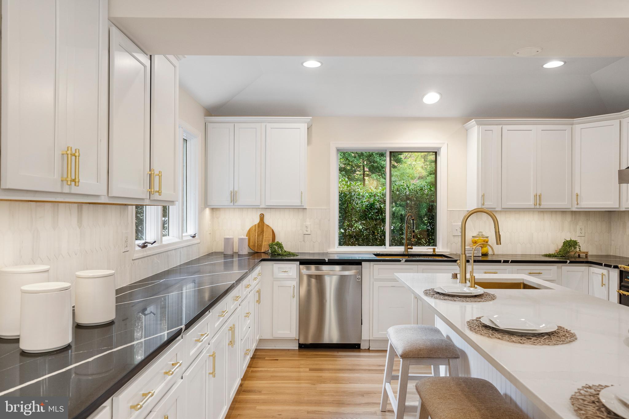 4 Bucksway Road Owings Mills, MD 21117 - Photo 12 of 57 a kitchen with sink a stove and cabinets