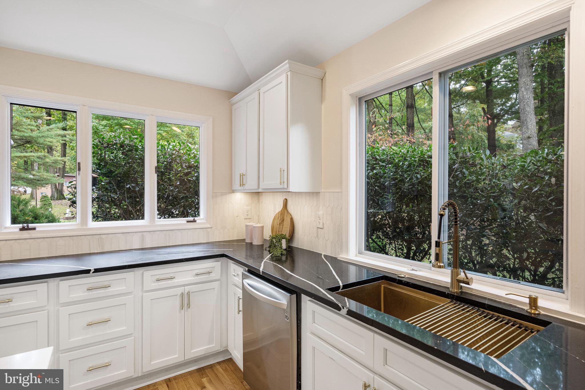 4 Bucksway Road Owings Mills, MD 21117 - Photo 13 of 57 a kitchen with granite countertop a sink and a window