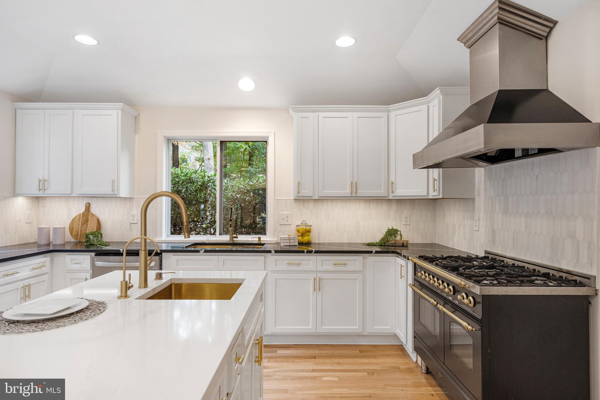 4 Bucksway Road Owings Mills, MD 21117 - Photo 15 of 57 a kitchen with stainless steel appliances granite countertop a sink stove and cabinets