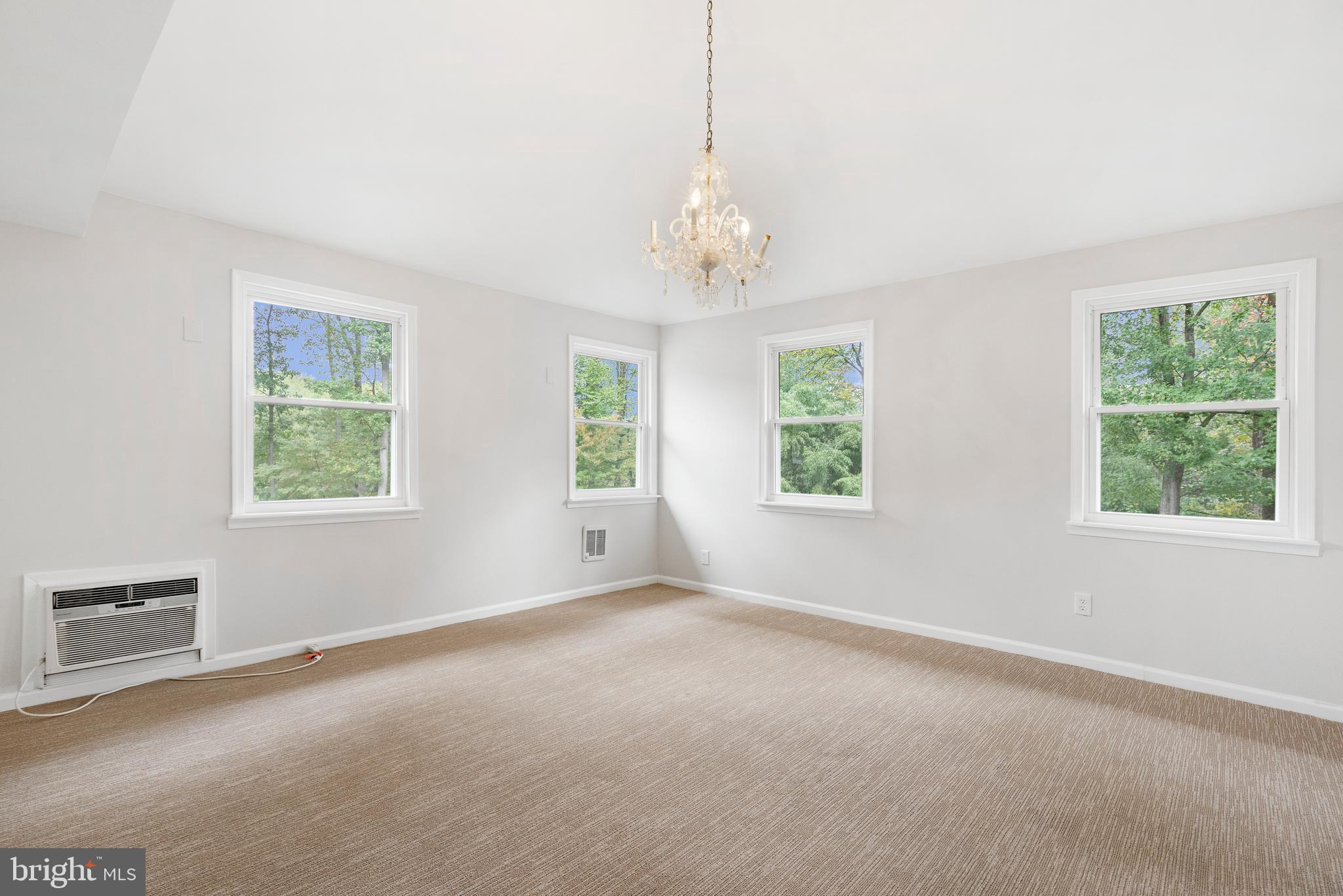 4 Bucksway Road Owings Mills, MD 21117 - Photo 26 of 57 an empty room with windows and chandelier