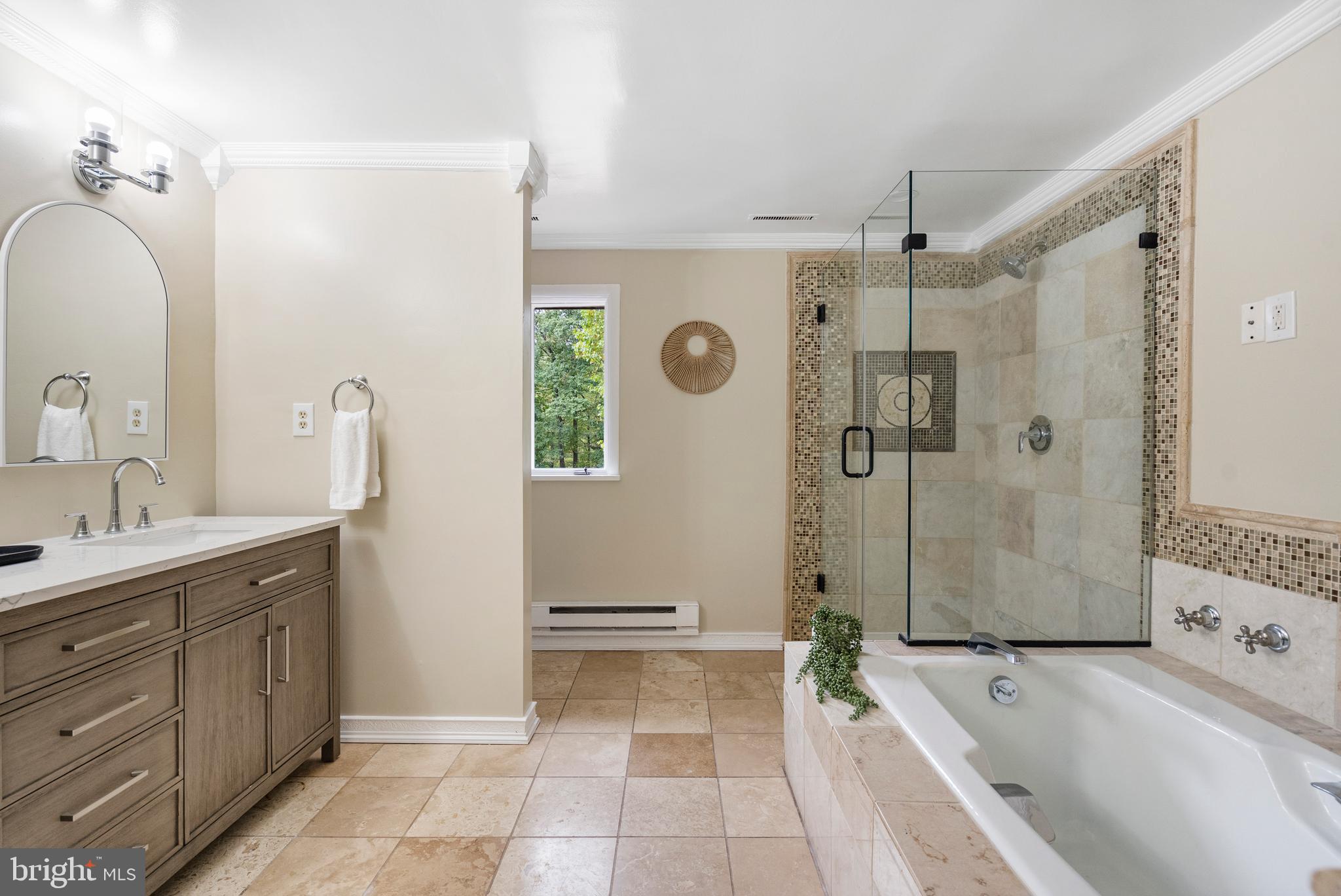 4 Bucksway Road Owings Mills, MD 21117 - Photo 29 of 57 a spacious bathroom with a tub sink and mirror
