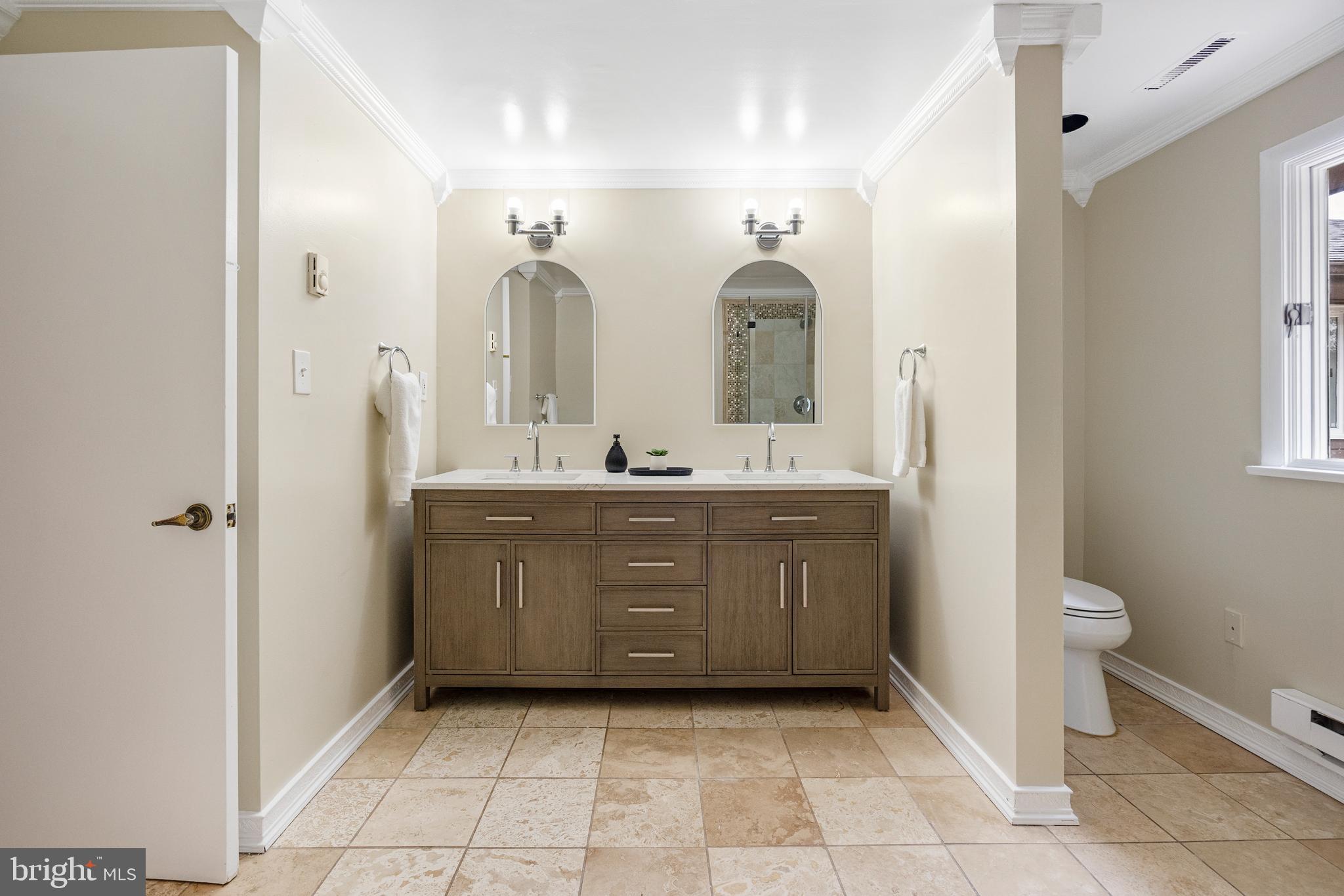 4 Bucksway Road Owings Mills, MD 21117 - Photo 30 of 57 a bathroom with a sink a toilet and a mirror