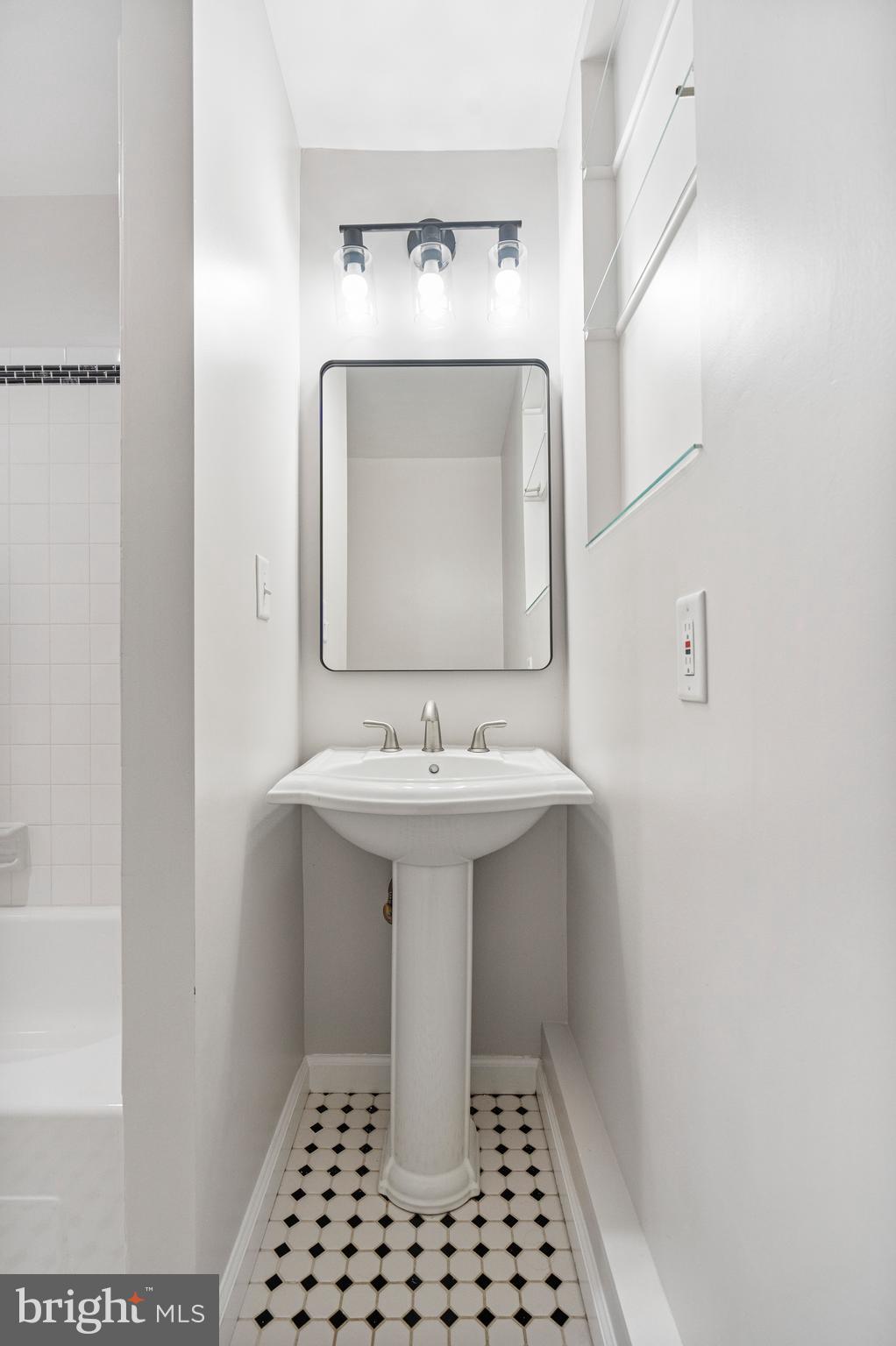 4 Bucksway Road Owings Mills, MD 21117 - Photo 47 of 57 a bathroom with a sink a mirror and a shower