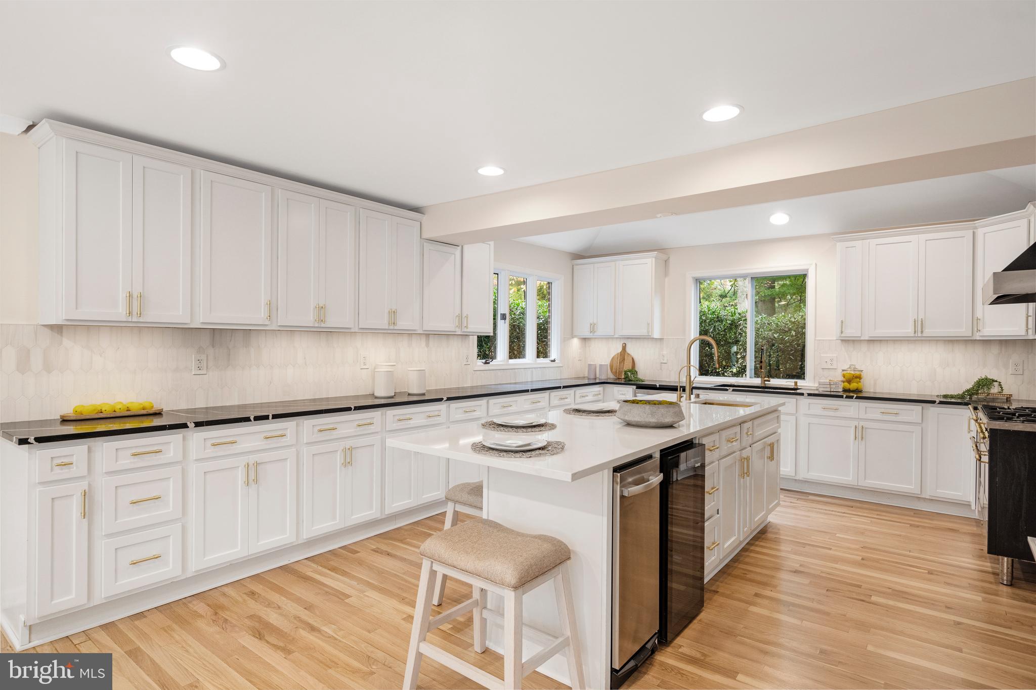 4 Bucksway Road Owings Mills, MD 21117 - Photo 9 of 57 a kitchen with granite countertop sink stove and cabinets