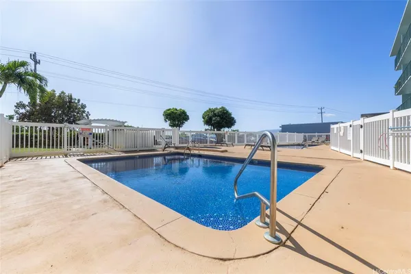 a view of swimming pool with seating space
