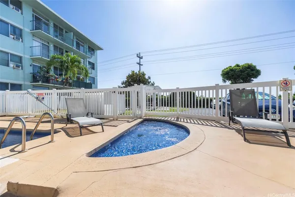 a view of a swimming pool and deck