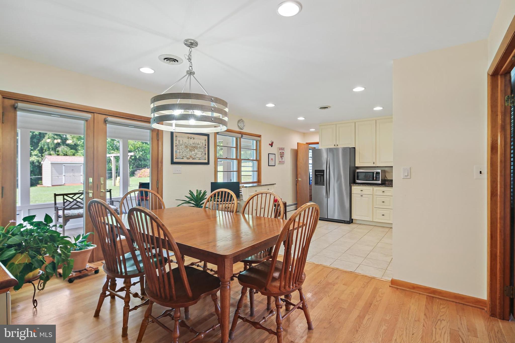 2114 Ruffs Mill Road Bel Air, MD 21015 - Photo 10 of 36 Dining room w/ sliders leading to a bright sunroom