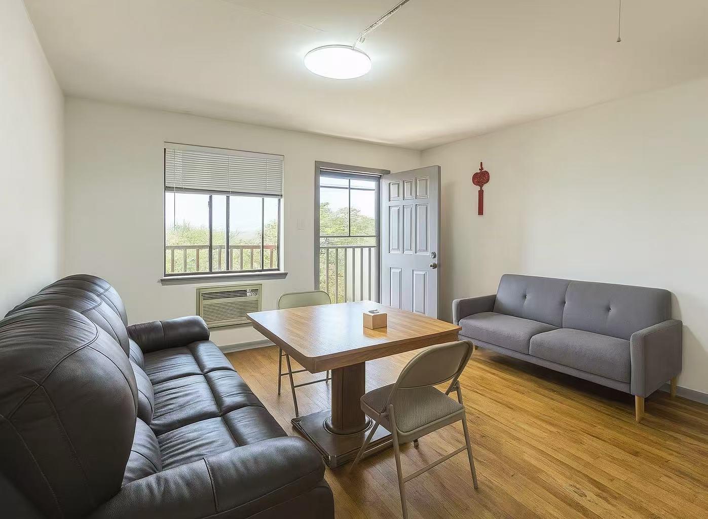 108-11 44th Avenue Queens, NY 11368 - Photo 2 of 11 a living room with furniture and a window