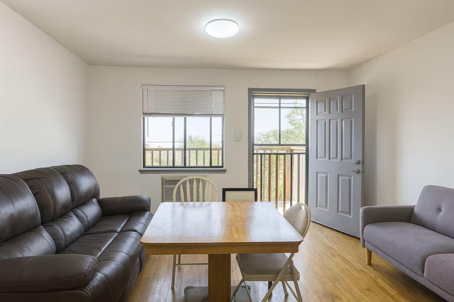 108-11 44th Avenue Queens, NY 11368 - Photo 3 of 11 a view of a livingroom with furniture and window
