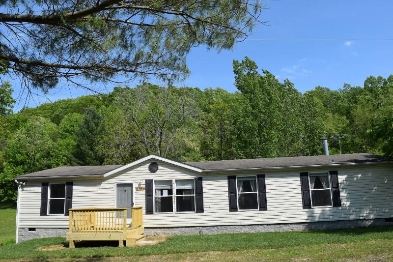 5296 Riner Road Riner, VA 24149 - Photo 3 of 18 a front view of a house with a yard