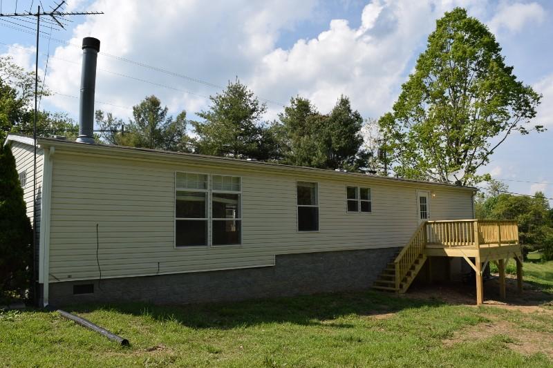 5296 Riner Road Riner, VA 24149 - Photo 4 of 18 a view of a house with a backyard