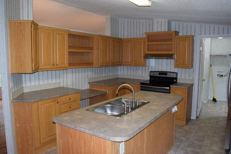 5296 Riner Road Riner, VA 24149 - Photo 8 of 18 a kitchen with a sink a stove and a refrigerator
