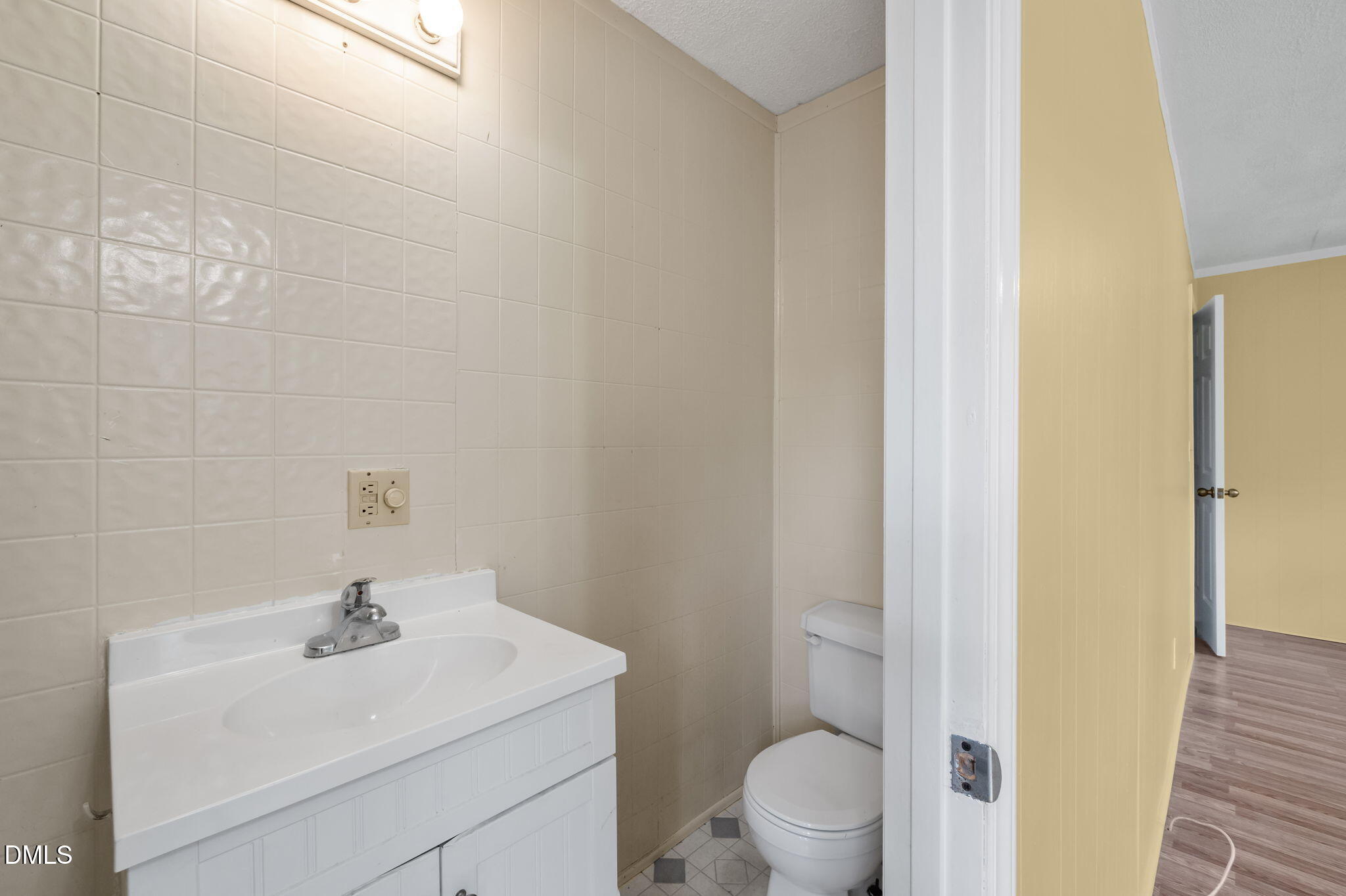 95 Harold Gill Road Roxboro, NC 27574 - Photo 21 of 53 a bathroom with a sink a toilet and a mirror