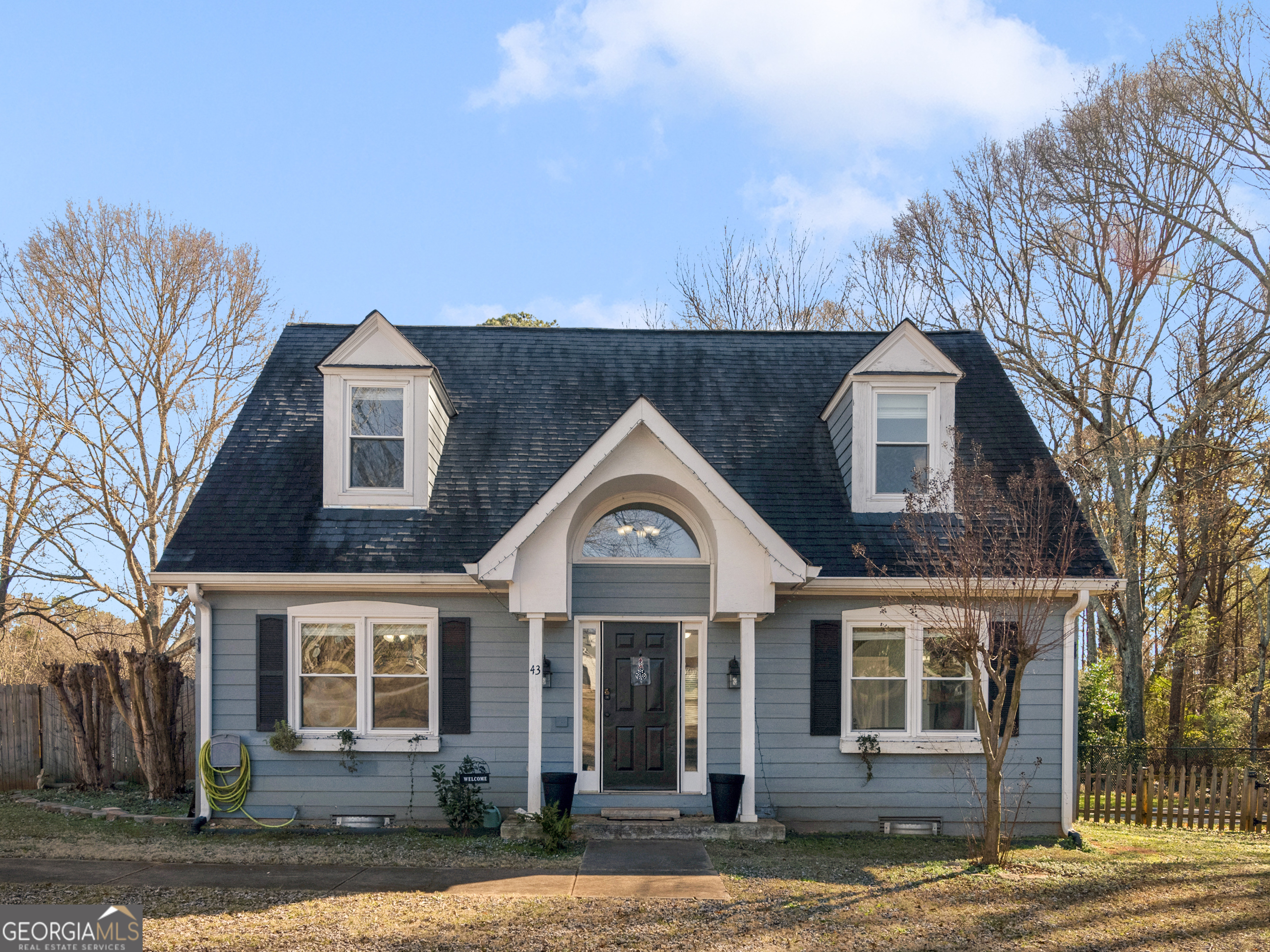 a view of a brick house with a large windows