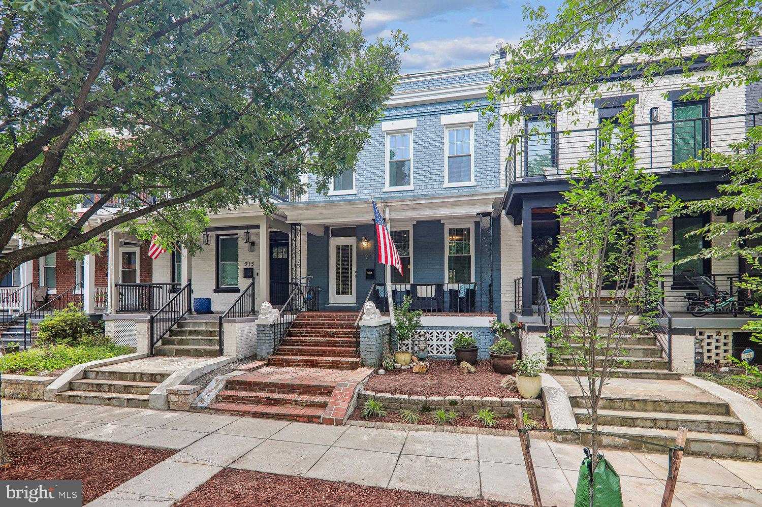 911 L Street Northeast Washington, DC 20002 - Photo 43 of 48 a view of a patio with table and chairs and potted plants
