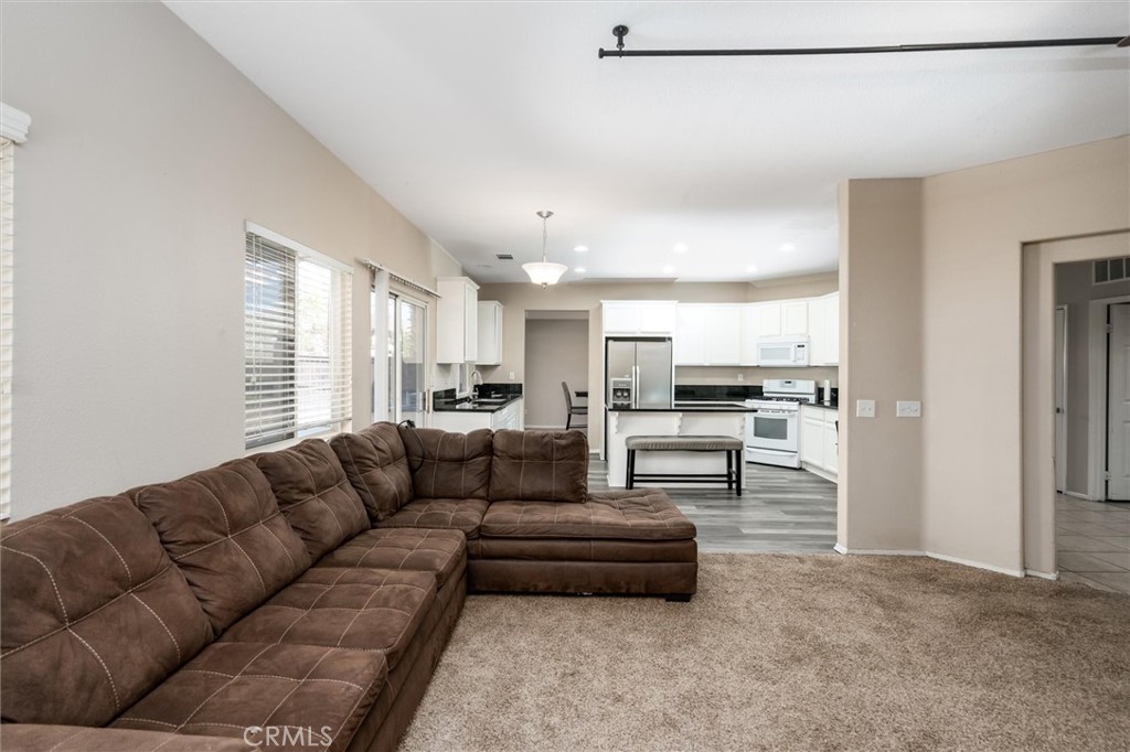 37867 Shady Maple Road Murrieta, CA 92563 - Photo 12 of 68 a living room with furniture and kitchen view