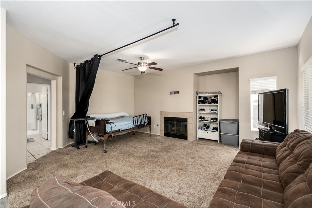 37867 Shady Maple Road Murrieta, CA 92563 - Photo 14 of 68 a living room with furniture and a flat screen tv