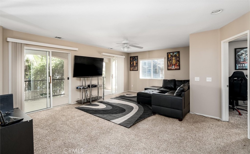 37867 Shady Maple Road Murrieta, CA 92563 - Photo 23 of 68 a living room with fireplace furniture and a flat screen tv