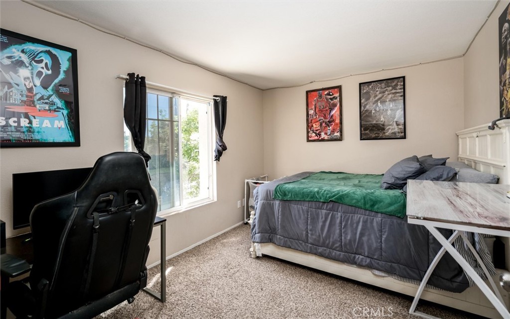 37867 Shady Maple Road Murrieta, CA 92563 - Photo 27 of 68 a bedroom with furniture and a window