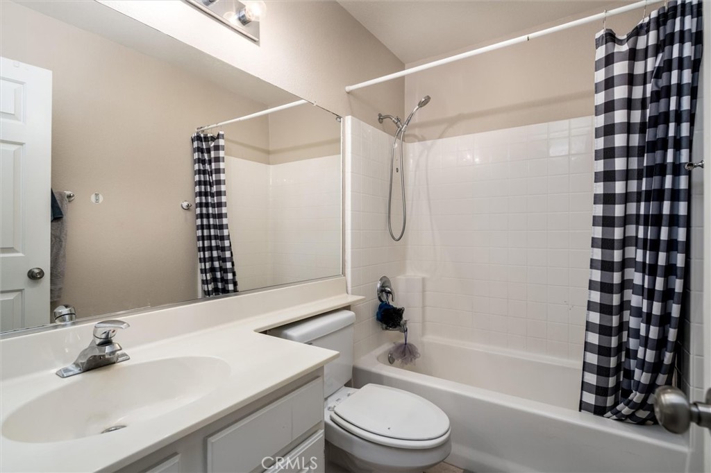 37867 Shady Maple Road Murrieta, CA 92563 - Photo 32 of 68 a bathroom with a sink toilet and shower