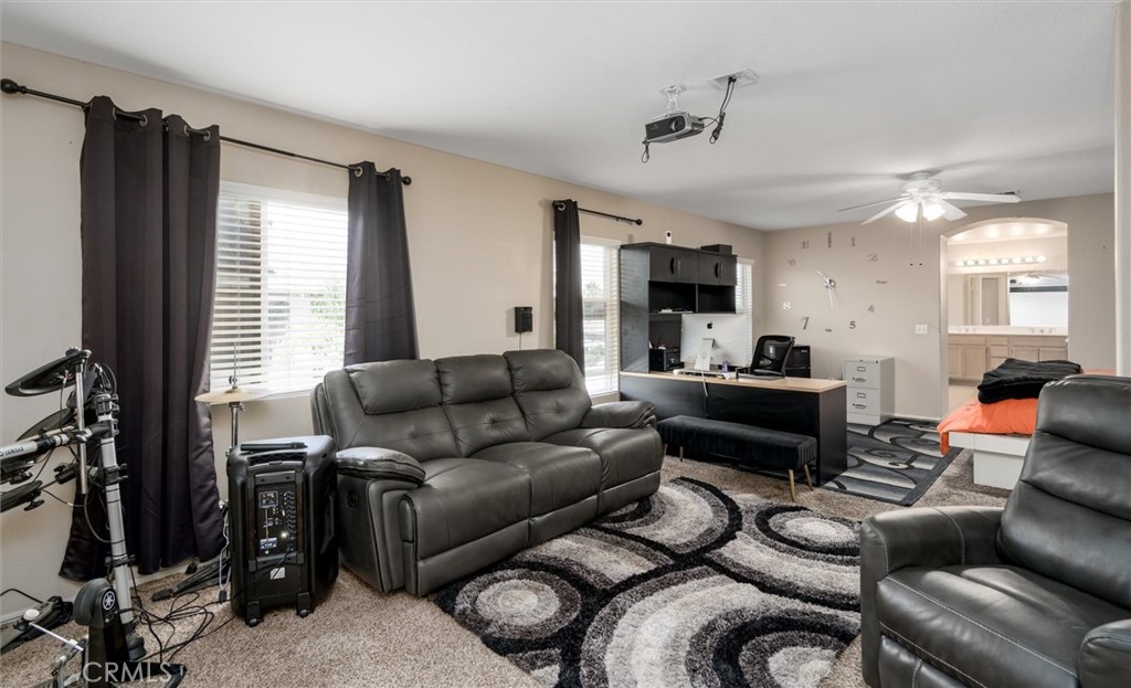 37867 Shady Maple Road Murrieta, CA 92563 - Photo 36 of 68 a living room with furniture and a flat screen tv