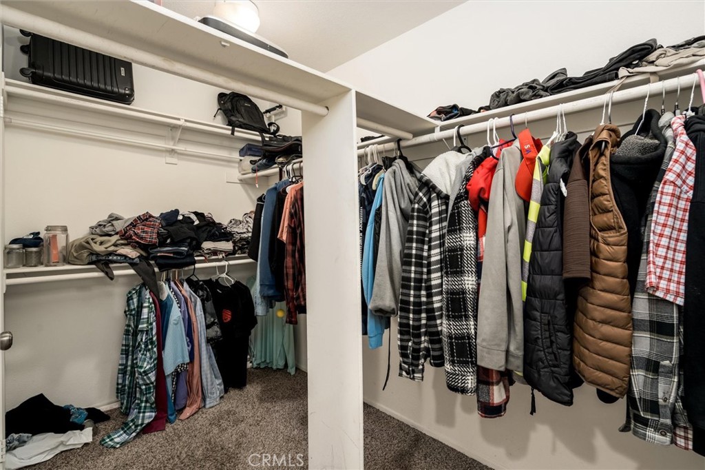 37867 Shady Maple Road Murrieta, CA 92563 - Photo 43 of 68 a view of walk in closet with clothes and shoes