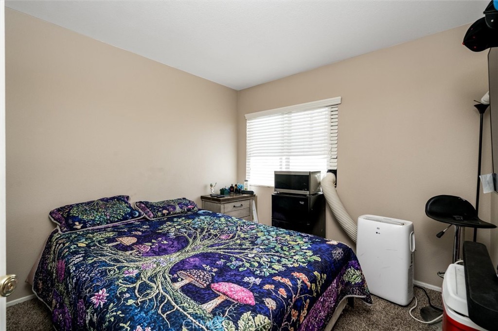 37867 Shady Maple Road Murrieta, CA 92563 - Photo 44 of 68 a bedroom with a bed and a window