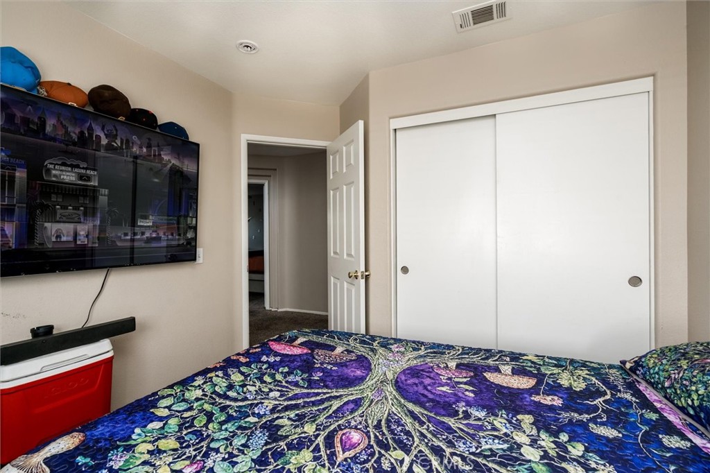37867 Shady Maple Road Murrieta, CA 92563 - Photo 45 of 68 a bedroom with a bed and a dresser