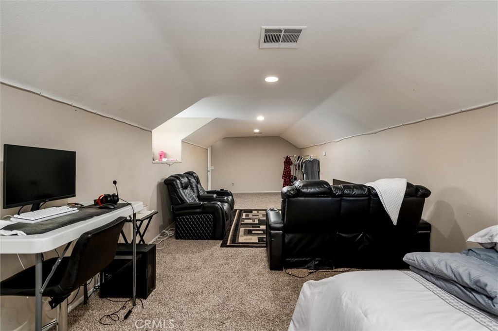 37867 Shady Maple Road Murrieta, CA 92563 - Photo 47 of 68 a living room with furniture and a flat screen tv