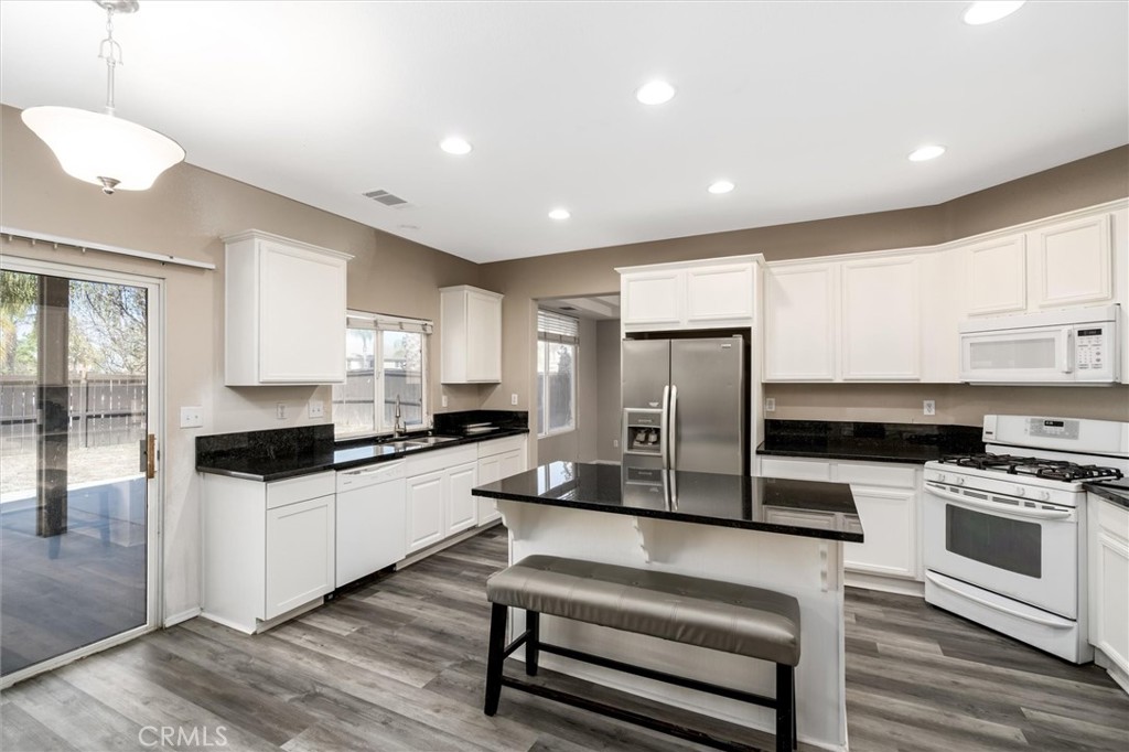 37867 Shady Maple Road Murrieta, CA 92563 - Photo 10 of 68 a kitchen with stainless steel appliances a stove a refrigerator and a sink