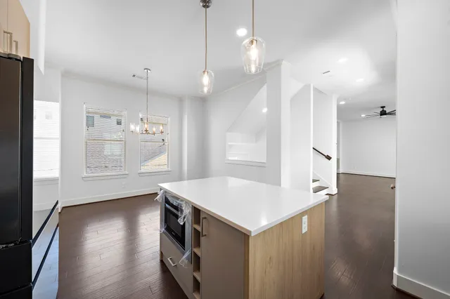 a bathroom with a tub sink shower and a mirror