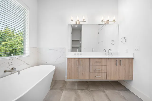 a bathroom with a shower and a glass door