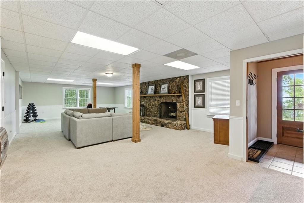 11 Brow Road Rome, GA 30165 - Photo 21 of 39 a living room with furniture and a flat screen tv