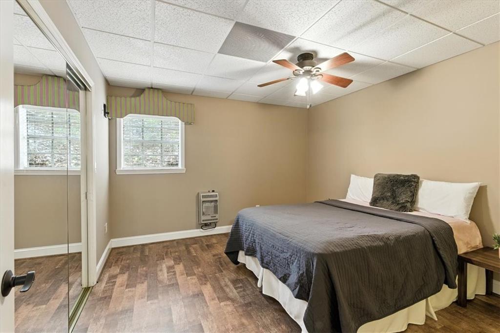 11 Brow Road Rome, GA 30165 - Photo 26 of 39 a bedroom with a bed and a chandelier