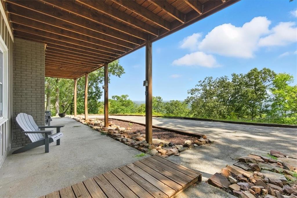 11 Brow Road Rome, GA 30165 - Photo 32 of 39 a view of a porch with furniture and floor to ceiling window