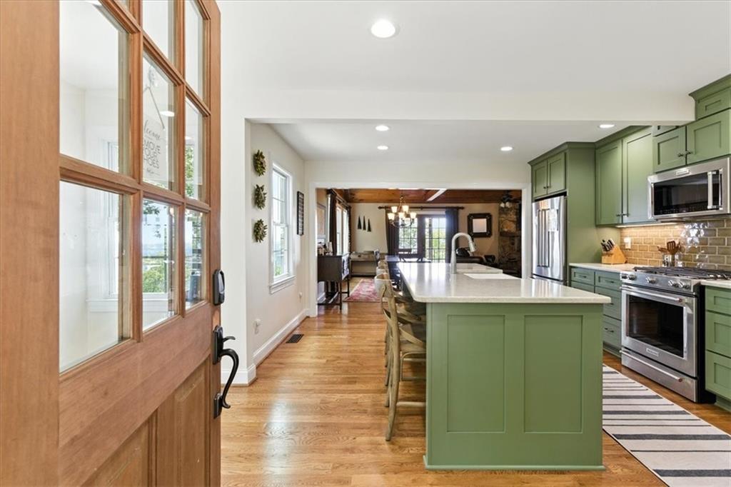 11 Brow Road Rome, GA 30165 - Photo 4 of 39 a large kitchen with stainless steel appliances granite countertop a large window and a counter space
