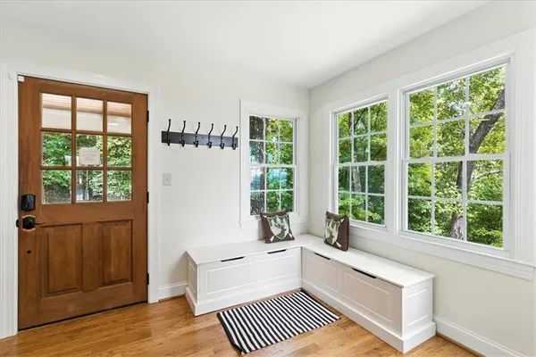 a bathroom with a large window vanity and living room