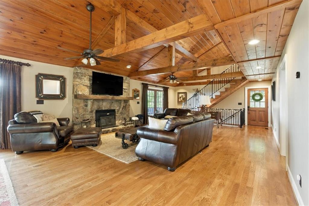 11 Brow Road Rome, GA 30165 - Photo 9 of 39 a living room with furniture a fireplace and a flat screen tv